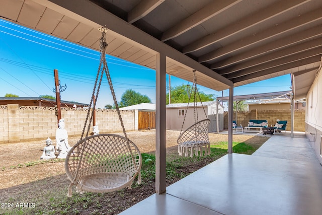 view of patio / terrace featuring a storage unit