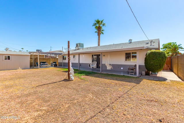 back of house featuring a patio and central AC