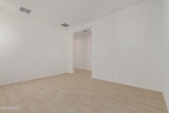 spare room featuring light wood-type flooring