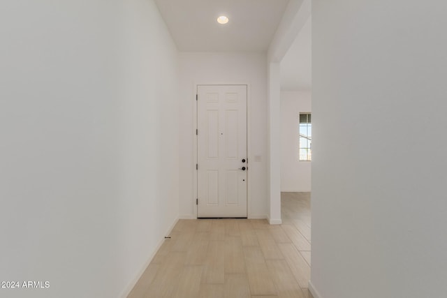 corridor featuring light hardwood / wood-style floors