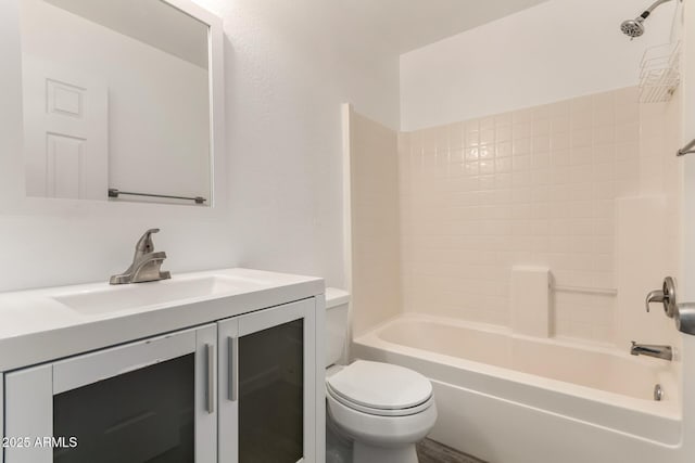 full bathroom featuring toilet, vanity, and bathing tub / shower combination