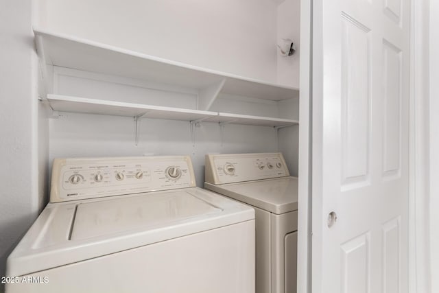 washroom featuring independent washer and dryer