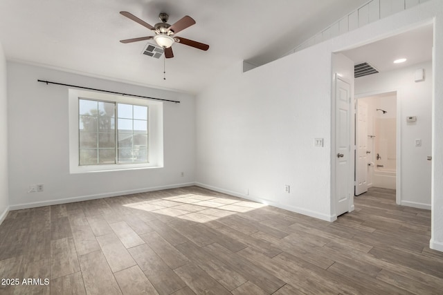 unfurnished room featuring ceiling fan and light hardwood / wood-style flooring