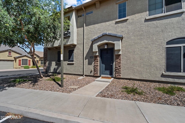 1350 S Greenfield Rd Unit 2133, Mesa, AZ 85206 - townhome / multi-family property featuring stucco siding and stone siding