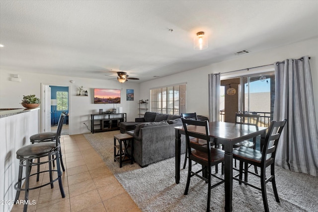 1350 S Greenfield Rd Unit 2133, Mesa, AZ 85206 - dining area with light tile patterned floors and a ceiling fan