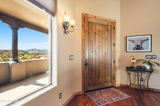 2259 Whitetail Ln, Prescott, AZ 86301 - entryway featuring a mountain view, baseboards, and dark wood-style flooring