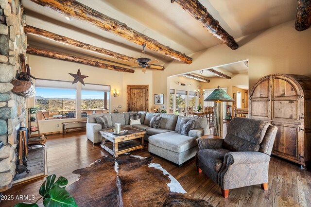 2259 Whitetail Ln, Prescott, AZ 86301 - living room featuring a wealth of natural light, a ceiling fan, dark wood-style flooring, and beamed ceiling