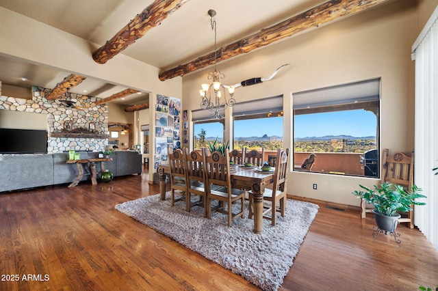 2259 Whitetail Ln, Prescott, AZ 86301 - dining space with wood finished floors, an inviting chandelier, visible vents, beamed ceiling, and a mountain view