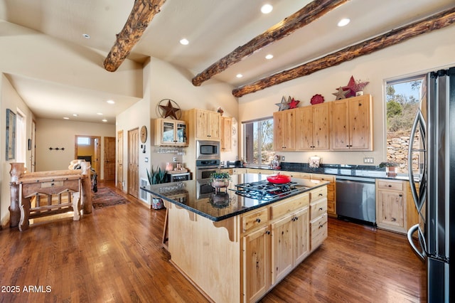 2259 Whitetail Ln, Prescott, AZ 86301 - kitchen with light brown cabinets, a kitchen breakfast bar, a center island, beamed ceiling, and appliances with stainless steel finishes