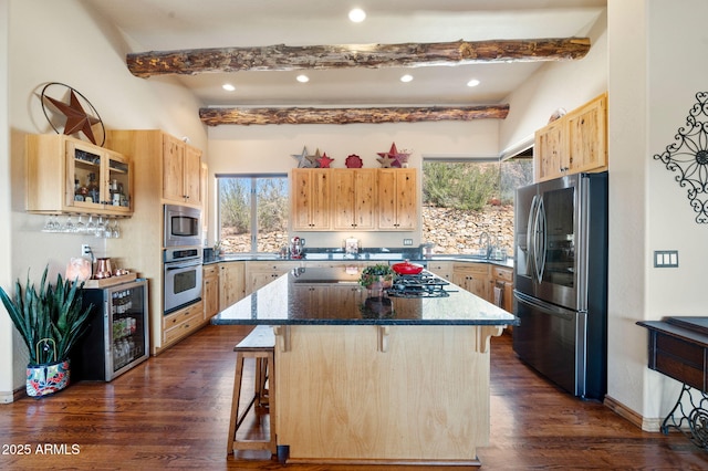 2259 Whitetail Ln, Prescott, AZ 86301 - kitchen with beam ceiling, a kitchen bar, light brown cabinets, a kitchen island, and appliances with stainless steel finishes