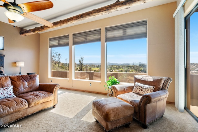 2259 Whitetail Ln, Prescott, AZ 86301 - carpeted living area featuring beamed ceiling, ceiling fan, and a mountain view