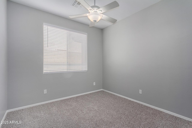 unfurnished room with carpet and ceiling fan