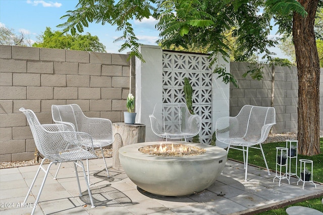 view of patio featuring an outdoor fire pit