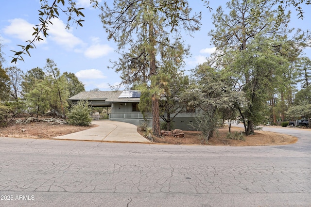 view of front of property with solar panels