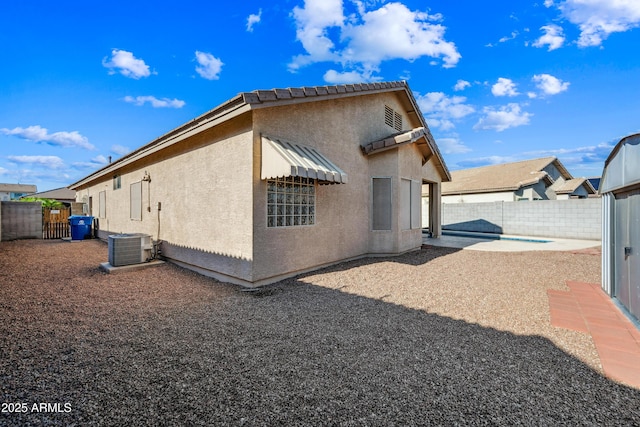 14625 W Redfield Rd, Surprise, AZ 85379 - back of property featuring a fenced backyard, stucco siding, and cooling unit