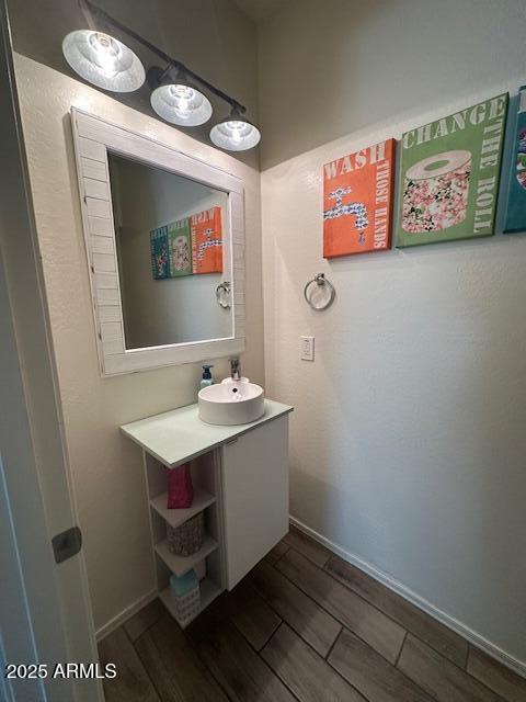 bathroom featuring vanity and wood-type flooring