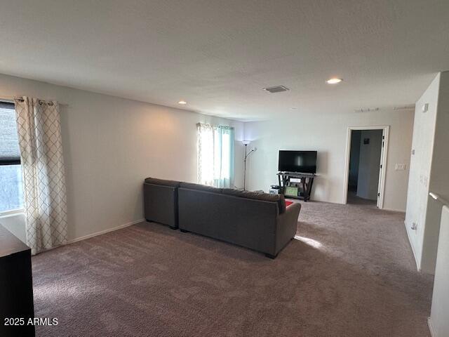 unfurnished living room with carpet flooring