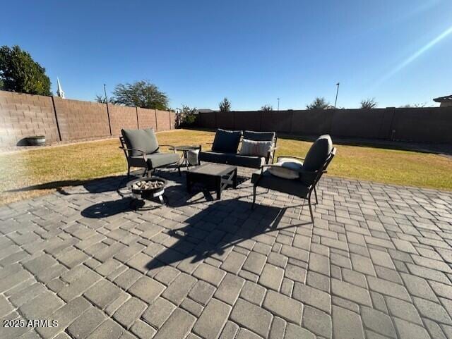 view of patio / terrace featuring a fire pit