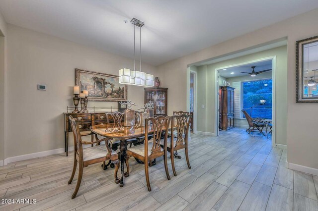 dining room featuring wood finish floors and baseboards