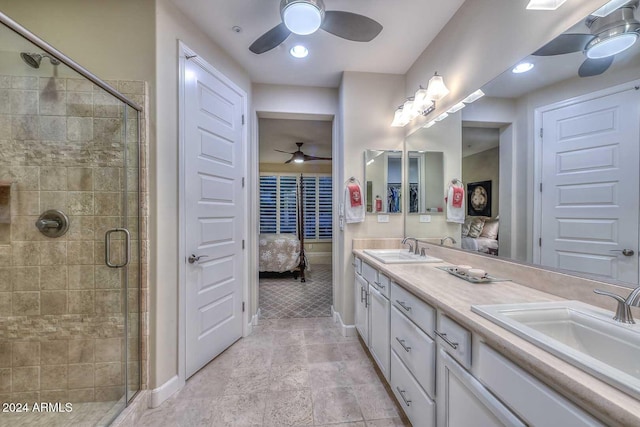 full bath with a shower stall, double vanity, a sink, and connected bathroom