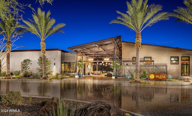 property at night with a water view