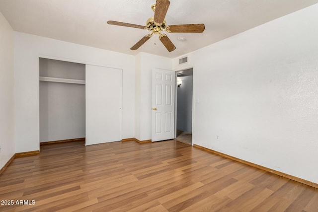 18239 N 40th St Unit 122, Phoenix, AZ 85032 - unfurnished bedroom with light wood-style floors, a closet, and a ceiling fan