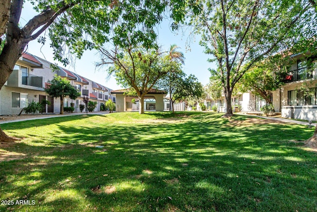 18239 N 40th St Unit 122, Phoenix, AZ 85032 - view of green lawn with a residential view