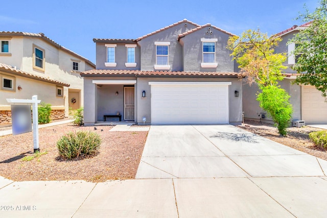 31269 N Cavalier Dr, San Tan Valley, AZ 85143 - mediterranean / spanish house featuring stucco siding, driveway, a tiled roof, and a garage