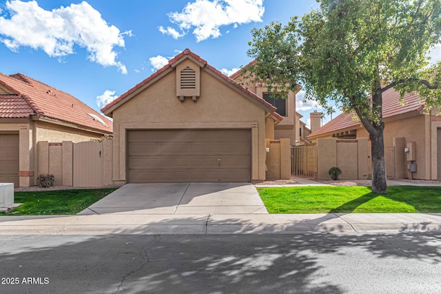 view of front of home with a garage and a front lawn