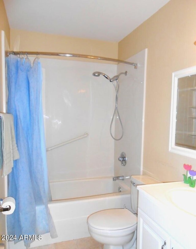 full bathroom with vanity, tile patterned floors, toilet, and shower / bath combo with shower curtain