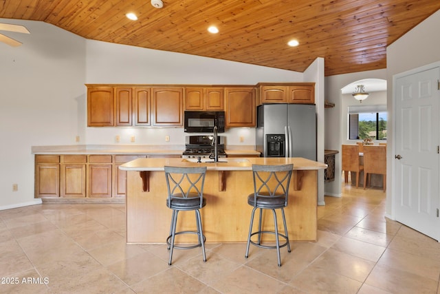106 N Lariat Way, Payson, AZ 85541 - kitchen featuring black microwave, wooden ceiling, stainless steel fridge, and lofted ceiling