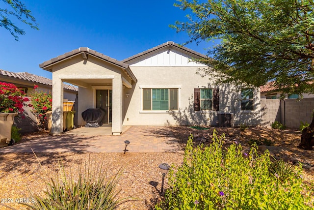 rear view of property featuring a patio area