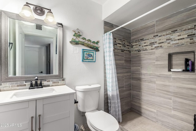617 E Calle Adobe Ln, Goodyear, AZ 85338 - bathroom with vanity and tiled shower