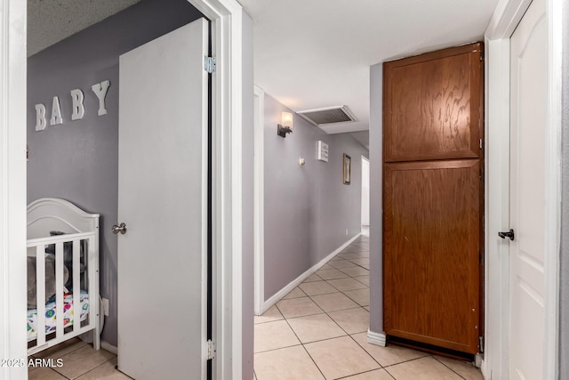 617 E Calle Adobe Ln, Goodyear, AZ 85338 - corridor with light tile patterned floors and baseboards