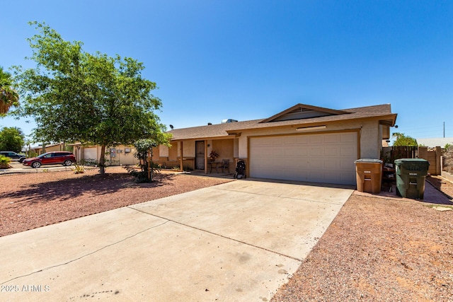 617 E Calle Adobe Ln, Goodyear, AZ 85338 - ranch-style home with stucco siding, an attached garage, and driveway