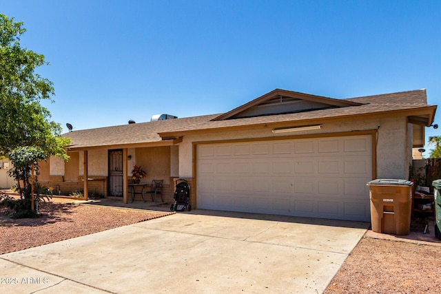617 E Calle Adobe Ln, Goodyear, AZ 85338 - ranch-style house with an attached garage, stucco siding, concrete driveway, and roof with shingles
