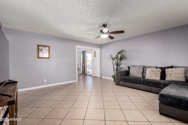 617 E Calle Adobe Ln, Goodyear, AZ 85338 - living room featuring ceiling fan, light tile patterned flooring, and a textured ceiling