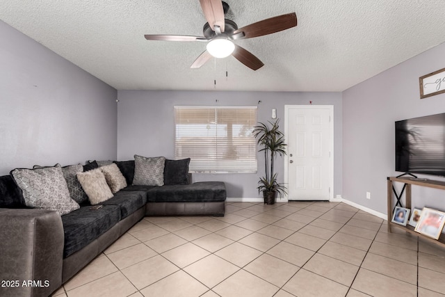 617 E Calle Adobe Ln, Goodyear, AZ 85338 - living room with a textured ceiling, a ceiling fan, and light tile patterned floors