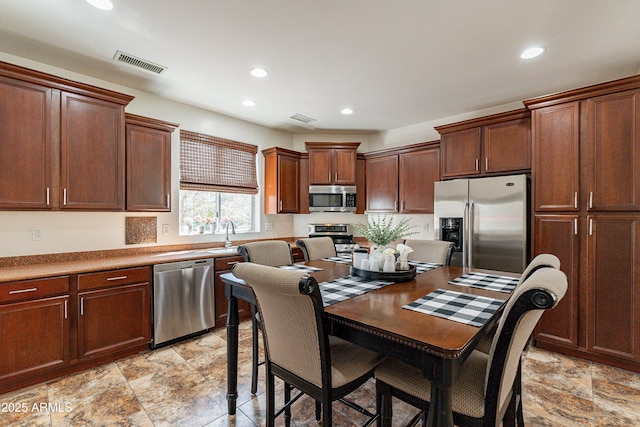 kitchen featuring recessed lighting, visible vents, and stainless steel appliances