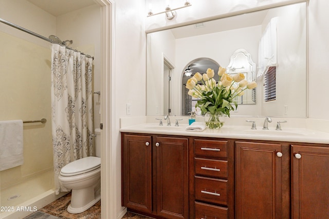 bathroom with a shower with curtain, double vanity, toilet, and a sink