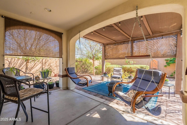 view of patio with a gazebo and fence