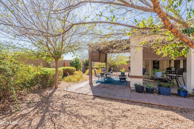 view of patio / terrace with fence private yard and a pergola