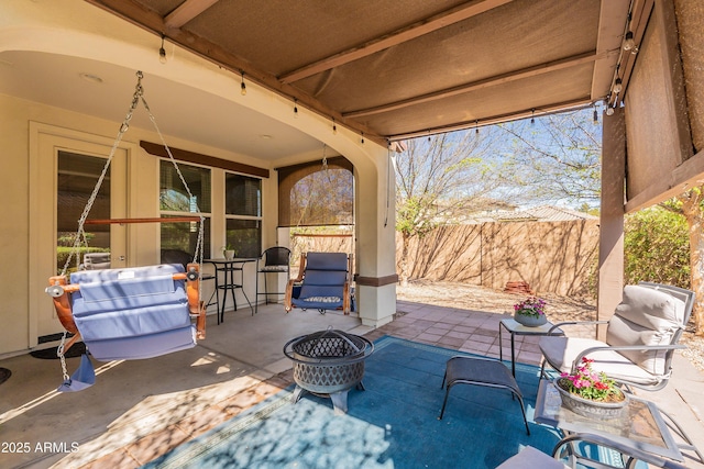 view of patio featuring fence