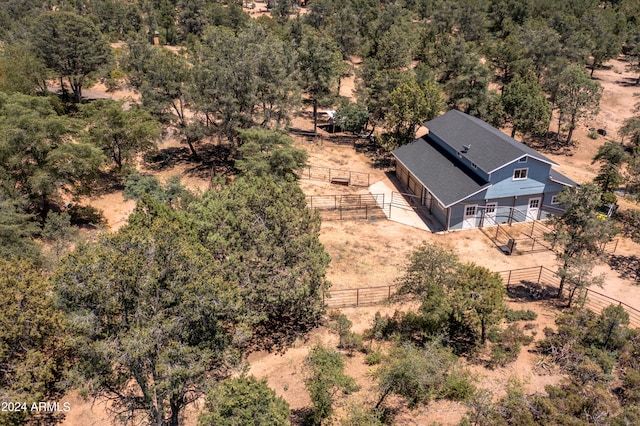 birds eye view of property with a rural view