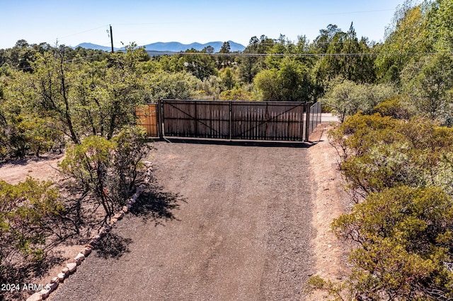 view of gate with a mountain view