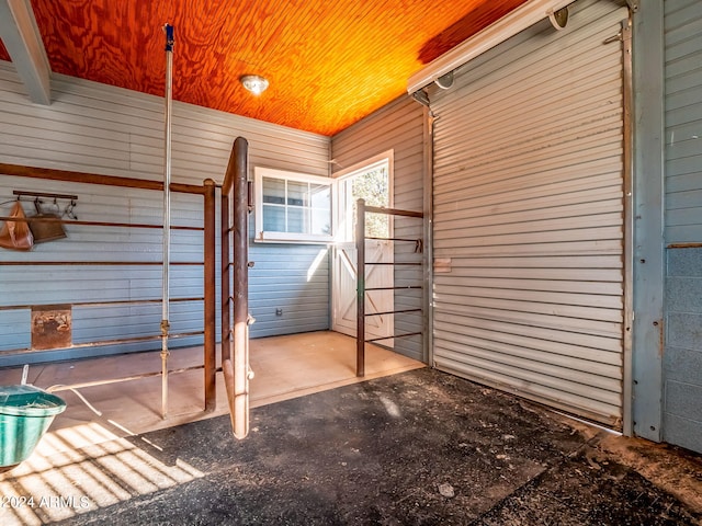 interior space featuring wooden walls