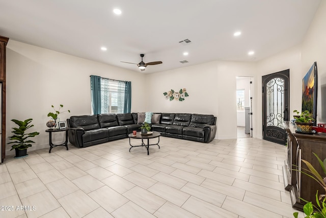 living area featuring recessed lighting, visible vents, and a ceiling fan