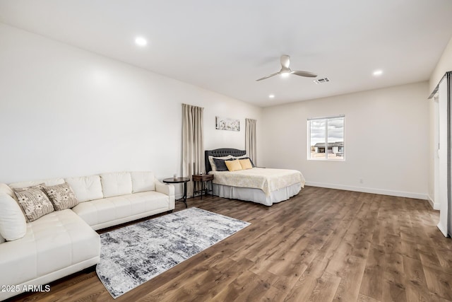 bedroom with visible vents, recessed lighting, wood finished floors, and baseboards