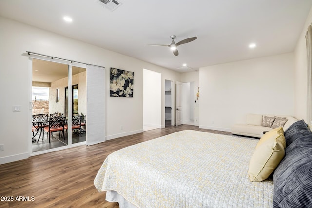 bedroom with recessed lighting, wood finished floors, visible vents, and baseboards