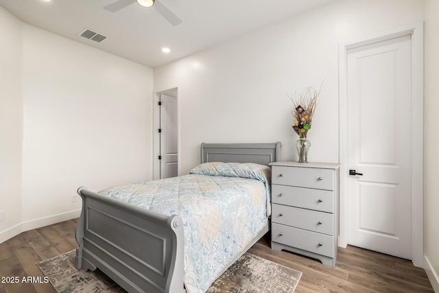 bedroom featuring recessed lighting, visible vents, baseboards, and wood finished floors